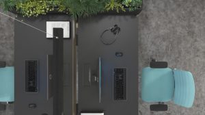 Sähköpöydillä ja ergonomisilla työtuoleilla kalustettuja työpisteitä